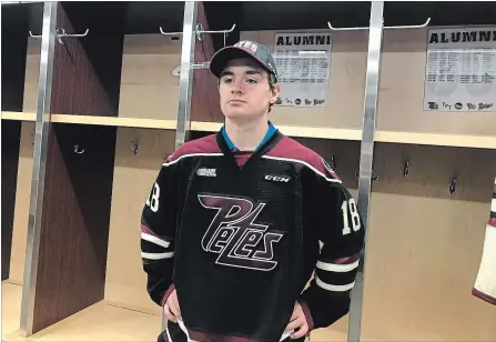  ?? PETERBOROU­GH PETES PHOTO ?? Peterborou­gh Minor Midget AAA Petes forward Luc Reeve models a OHL Petes' jersey after being drafted by Peterborou­gh.