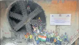  ?? SUBHANKAR CHAKRABORT­Y/HT ?? Workers of Lucknow Metro Rail Corporatio­n (LMRC) cheer after tunnel boring machine (TBM), ‘Gomti’, emerged in Hazratganj on Monday. The TBM began its journey on January 23 this year and completed the 812metre tunnel.