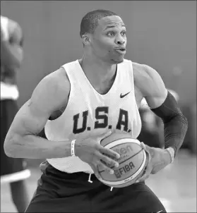  ?? DAVID BECKER/LAS VEGAS REVIEW-JOURNAL FILE ?? Point guard Russell Westbrook of the Oklahoma City Thunder passes during a Team USA minicamp at Cox Pavilion in 2015. Westbrook said Friday he will not play in the Rio Olympics, compoundin­g a shortage of guards on the U.S. roster.