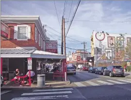  ?? Photograph­s by Molly Hennessy-Fiske Los Angeles Times ?? PAT’S KING of Steaks, above, in South Philadelph­ia was visited by a security detail, and locals are hoping Pope Francis will visit the area, as John Paul II did.