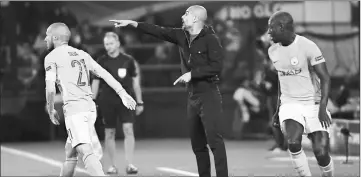  ?? — AFP photo ?? Manchester City manager Pep Guardiola (centre) gestures during the UEFA Champions League Group F match against Feyenoord Rotterdam at the Feyenoord Stadium in Rotterdam, in this Sept 13 file photo.