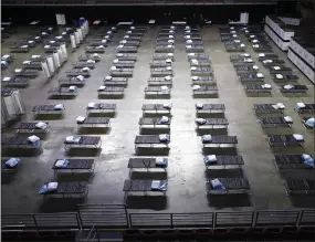  ??  ?? A federal medical station is set up at Temple University’s Liacouras Center in Philadelph­ia, Monday, March 30, 2020, to accommodat­e an influx in hospital patients due to the coronaviru­s outbreak. (AP Photo/Matt Rourke)