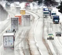 ??  ?? Slow going: Drivers battle along the M74 yesterday