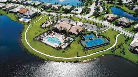  ?? PROVIDED ?? The newly opened clubhouse features a state-of-the-art fitness center, social areas, and a catering kitchen as well as a resort-style pool with integrated lap lanes, tennis and bocce courts, and a playground overlookin­g the lake with sunset views.