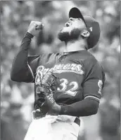  ?? MORRY GASH/AP ?? Brewers closer Jeremy Jeffress reacts after getting Ryan McMahon to ground out to end Game 2 on Friday night.