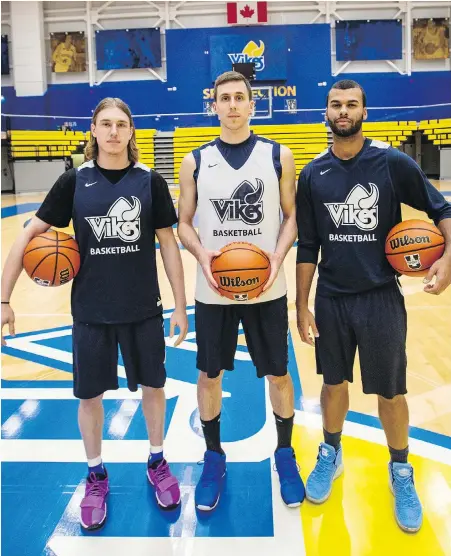  ?? DARREN STONE, TIMES COLONIST ?? Mason Loewen, left, Jake Newman and Jordan Charles are all in their fifth year with the veteran-laden UVic Vikes.