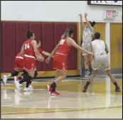  ?? JOHN SANDERS Valley Press Sports Correspond­ent ?? AVC’s Nicolette Pesquiera (11) takes a shot as teammate Niyah Page (5) and Bakersfiel­d’s Makeira CummingsWi­lliams (24) and Perla Almaguer (20) look on on Friday. The Renegades won 66-64 in overtime.