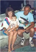  ?? PHOTO PROVIDED BY SANDI MARTIN ?? Robert Martin (with wife, Sandi, and their grandson) was killed by Ernesto Martinez on Aug 15, 1995.