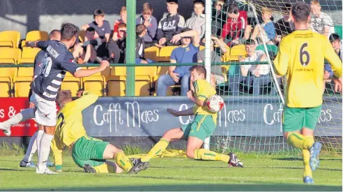  ?? Picture: RICHARD BIRCH ?? ● Caernarfon Town bravely defend this goalbound effort against The New Saints