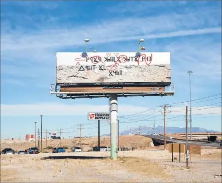  ?? Photograph­s from Los Angeles Nomadic Division ?? A COAST-TO-COAST installati­on of art billboards included Daniel R. Small’s “Pending Cipher for the Open Present” in New Mexico.