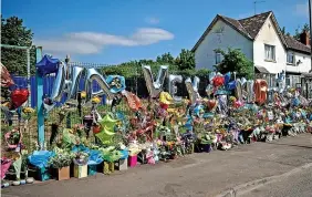  ?? JONATHAN MYERS ?? Masses of floral and balloon tributes have been left to Harvey Evans, 15, and Kyrees Sullivan, 16, near the scene of the devastatin­g crash