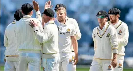  ?? PHOTO: PHOTOSPORT ?? Logan van Beek (centre) celebrates a Canterbury scalp with Wellington teammates.