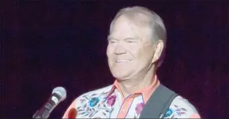  ?? The Associated Press ?? This Sept. 6, 2012 file photo shows singer Glen Campbell performing during his Goodbye Tour in Little Rock, Ark.