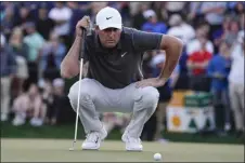  ?? DARRYL WEBB — THE ASSOCIATED PRESS ?? Scottie Scheffler reads a putt on the 18th hole during the third round of the Phoenix Open on Saturday in Scottsdale, Ariz.