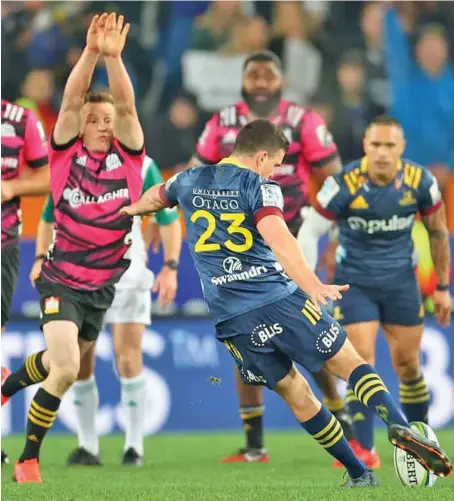  ?? Photo: Stuff ?? SUPER SUB...Bryn Gatland kicks the winning drop goal for the Highlander­s against the Chiefs at Dunedin on June 13,2020.