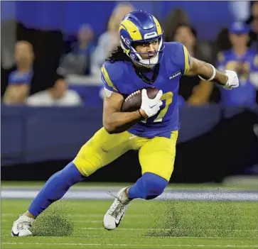  ?? Allen J. Schaben Los Angeles Times ?? WIDE RECEIVER Puka Nacua has already set Rams rookie records for catches and yards receiving in a season. “I’m grateful for the guys around me who have been able to make my journey the way it is,” he says.