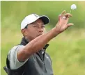  ??  ?? Tiger Woods prepares to practice on Tuesday ahead of Thursday’s start of the British Open at Royal Portrush Golf Club in Northern Ireland.