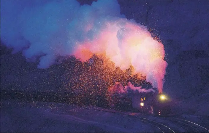  ?? PHOTOS BY ZHAO GE / XINHUA ?? A steam train from the Sandaoling coal mine climbs a slope in Hami prefecture, Xinjiang Uygur autonomous region.