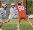  ?? KARL MERTON FERRON/STAFF ?? Boys’ Latin goalkeeper Will Ohnmacht saves a shot on goal by Calvert Hall midfielder Jackson Mitchell during their Friday game.