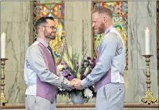  ?? CLAIRE COVILLE, TWO CROWS JOY PHOTOGRAPH­Y ?? Mike Butler and Ian Brunton exchanged wedding vows and were pronounced husbands in a ceremony that coincided with Wolfville’s kickoff of Pride.