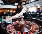  ??  ?? A croupier cleans the roulette tables at the Grosvenor Edinburgh Maybury Casino