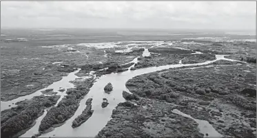  ?? GERALD HERBERT/AP PHOTOS ?? Davis Pond Diversion in St. Charles Parish, La., was built to channel freshwater from Mississipp­i River into Barataria Bay.