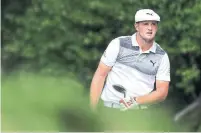  ?? MEL EVANS THE ASSOCIATED PRESS ?? His win on Sunday moved Bryson DeChambeau closer to two goal — landing a Ryder Cup spot and winning the FedEx Cup.