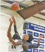  ?? STAFF PHOTO BY MATT HAMILTON ?? Tyner’s Kaileigh Chubb defends as Chattanoog­a Christian’s Christal Collins puts up a shot on Tuesday.