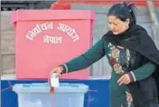  ?? AFP ?? A Nepali voter casts her ballot at a polling station during the final round of parliament­ary elections in Kathmandu on Thursday.