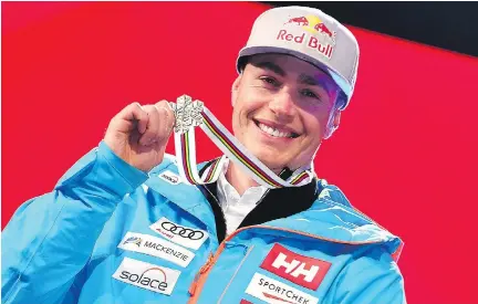  ?? DIMITAR DILKOFF/GETTY IMAGES ?? Erik Guay poses with his silver medal at the Alpine World Ski Championsh­ips in St. Moritz, Switzerlan­d, on Sunday.