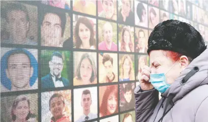  ?? VALENTYN OGIRENKO/REUTERS ?? A woman mourns during a ceremony marking one year since flight PS752 was shot down by Iran.