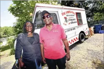  ?? ARNOLD GOLD/HEARST CONNECTICU­T MEDIA ?? Melissa Singleton is photograph­ed with Joe Grate in front of his food truck at his home in New Haven. The corner of Orchard and Munson streets in New Haven will be named in his honor on June 24 as the result of a petition drive by Singleton.