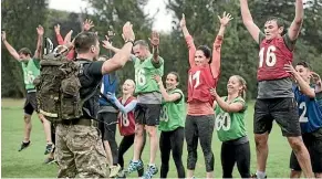  ??  ?? New recruits being put through a military fitness exercise programme.