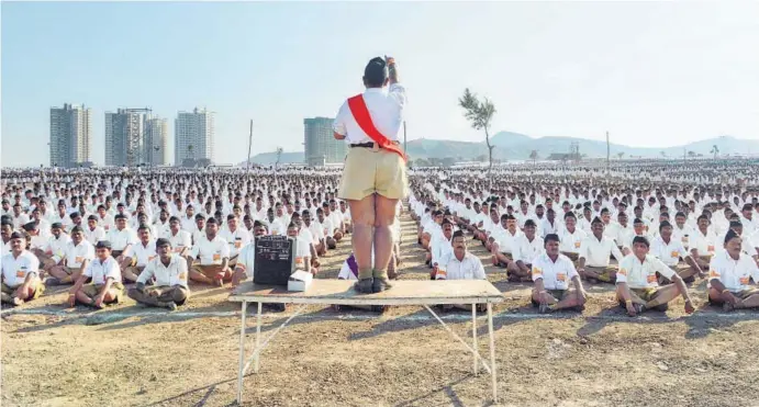  ?? AFP PHOTO ?? Rashtriya Swayamseva­k Sangh (RSS) volunteers listen to instructio­ns at a rally in Pune on January 3, 2016. Over 150,000 RSS volunteers attended the day long congregati­on Shivashakt­i Sangam.