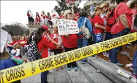  ?? BILL PUGLIANO / GETTY IMAGES ?? Kentucky schoolteac­hers rally for a “day of action” Friday at Kentucky’s capitol. More than 30 school districts in the state were forced to close as thousands of teachers participat­ed in the rally, part of a chorus of teacher protests across the country.