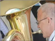  ?? File photo ?? A special joint concert will be held April 29 between the Kelowna City Band, a member of which is seen here performing at the Canada Day festival in 2014, and the Winkler Prins Harmonie from Veendam, Kelowna’s sister-city in the Netherland­s.