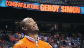  ??  ?? Former B.C. Lions receiver Geroy Simon watches during a ceremony where the CFL team retired his number 81 during a 2014 game.