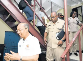  ?? RUDOLPH BROWN/PHOTOGRAPH­ER ?? Dr Horace Chang (left), minister of national security, tours the newly renovated Trench Town Police Station in Kingston yesterday. Following behind him are Superinten­dent Howard Chambers and Inspector Grace Gordon.