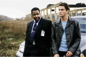  ??  ?? For five career-defining seasons on HBO’s The Wire, between 2002 and 2008, Pierce played Baltimore detective ‘Bunk’ Moreland. Pictured above with co-star Dominic West