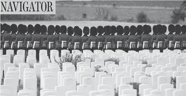  ?? JOHN THYS / AGENCE FRANCE-PRESSE / GETTY IMAGES ?? British Foot Guards participat­e in commemorat­ions for the 100th anniversar­y of the Battle of Passchenda­ele, which took place between July 31 and Nov. 6, 1917, in Belgium.