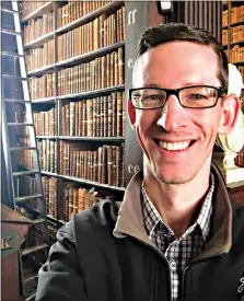  ?? Eric Little via AP ?? This photo shows Eric Little on June 17, 2019, in the Long Room of the Old Library at Trinity College in Dublin, Ireland. Little, a high school teacher from Houston, says lockdown has reinforced how motivating his in-classroom relationsh­ips with his students are to his life. As the health crisis has changed the world and pushed people together and out of old routines, it has also, for many, revealed some surprising traits within themselves.