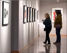  ?? JENNY SPARKS — LOVELAND REPORTER-HERALD ?? Cherie Nobilette, left, and Jackie Aves get a closer look at some of the art on display Thursday, as part of the NEW YORK/NEW YORK The Avant-garde from Mid-century exhibit at the Loveland Museum.