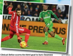  ?? GETTY IMAGES ?? Clinical: Defoe scores his third goal to bury Swansea