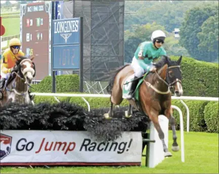  ?? FILE PHOTOS ?? Portrade, with jockey Gustav Dahl up, clears the second gate in the NY Turf Writers Cup on the Mellon turf course Thursday, Aug. 25, 2016 at Saratoga Race Course.