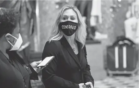  ?? SUSAN WALSH/ AP ?? Rep. Marjorie Taylor Greene, R- Ga., on Capitol Hill on Jan. 13, wears a “CENSORED” face mask.