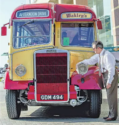  ??  ?? All aboard Nick Szkiler polishes his 1950s Leyland Harrington coach at the Festival of Vintage yesterday. One of only three in the world that remain in working order, it joined other historic vehicles on display at the annual event, held at York...