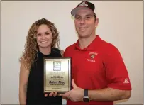  ?? ?? Upper Lake High School athletic director Brian Figg is the recipient of the inaugural Coastal Mountain Conference Athletic Director of the Year Award. He was honored earlier in the week when the CMC principals and athletic directors met at Cloverdale High School. Looking on is Upper Lake principal Annie Pivniska-Petrie.