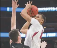  ?? NWA Democrat-Gazette file photo/BEN GOFF @NWABENGOFF ?? Daniel Gafford of Arkansas tries to put a shot up as Nate Fowler of Butler defends in the first half March 16 in the first round of the NCAA Tournament at Little Caesars Arena in Detroit.