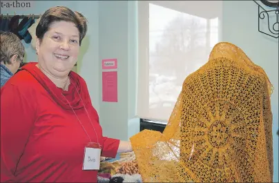  ?? ELIZABETH PATTERSON/CAPE BRETON POST ?? Barb Landry shows an intricate shawl she has created. Landry has donated the pattern for this shawl to be used by the McConnell Library in Sydney as a fundraiser for its children’s and teen programs. The pattern is for sale at the library and will be...