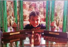  ?? SUBMITTED PHOTO ?? JJ Habres, 8, with his 2016 and 2017 World Pinewood Derby first-place trophies.